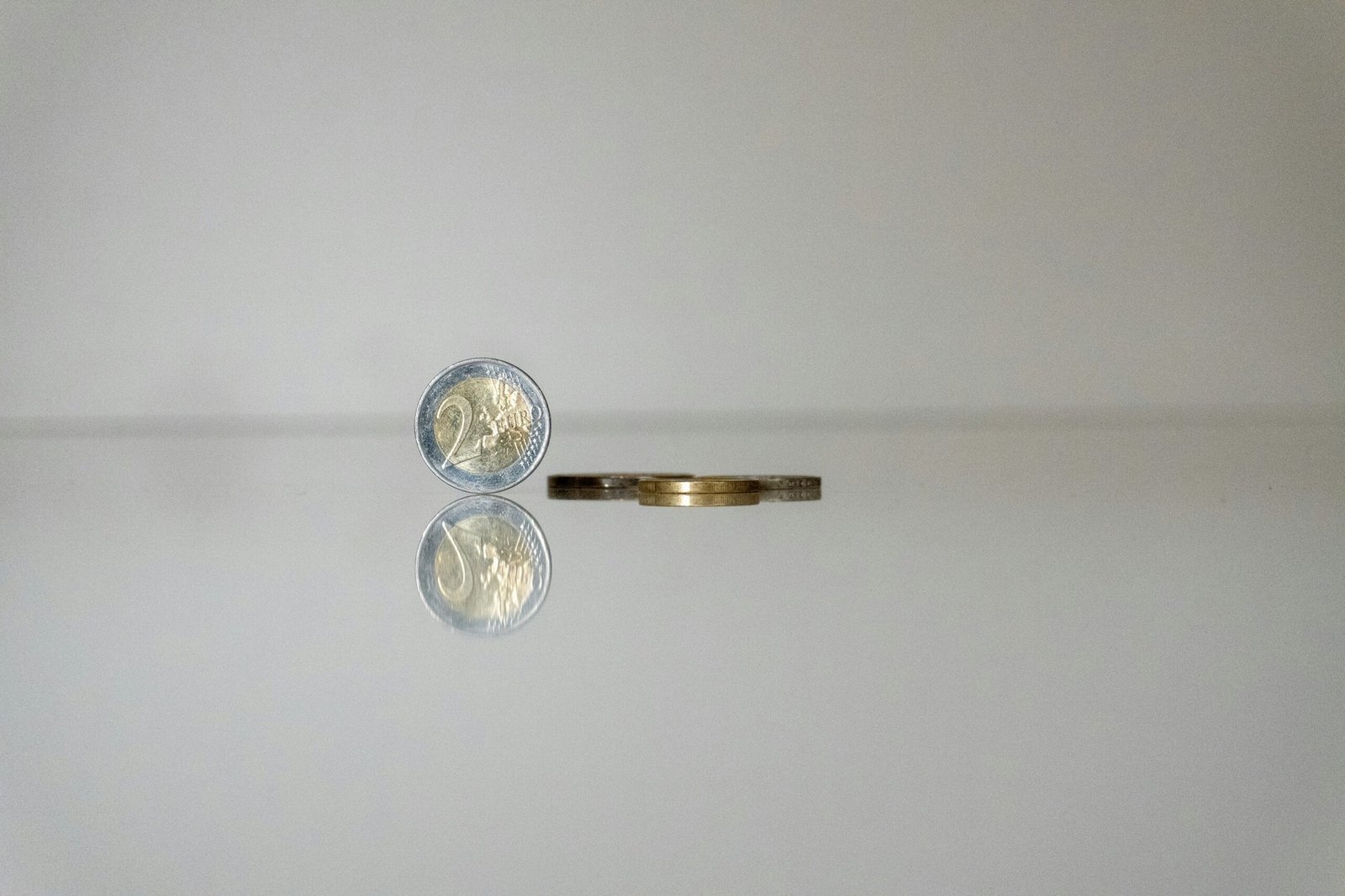 a gold ring with a coin on top of it